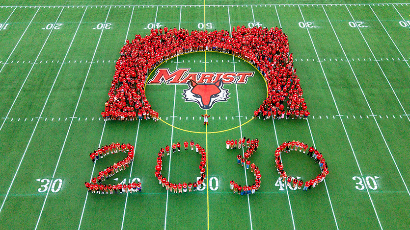 Image of the class of 2030 on the football field in the
