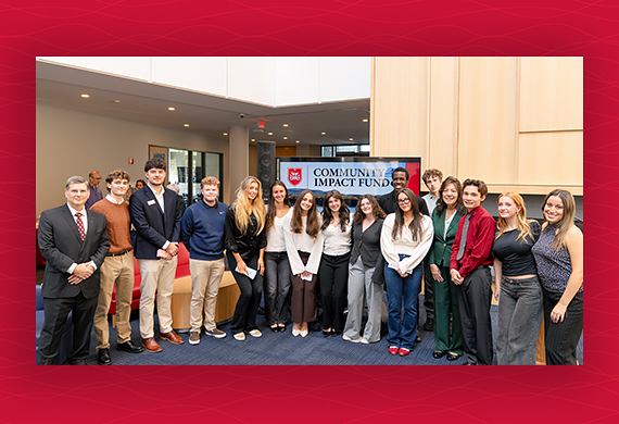 Students, Dr. Jim Melitski, and Dutchess County Executive Sue Serino gather for the launch of the Community Impact Fund Launch in the Dyson Center. Photo by Nelson Echeverria/Marist University.