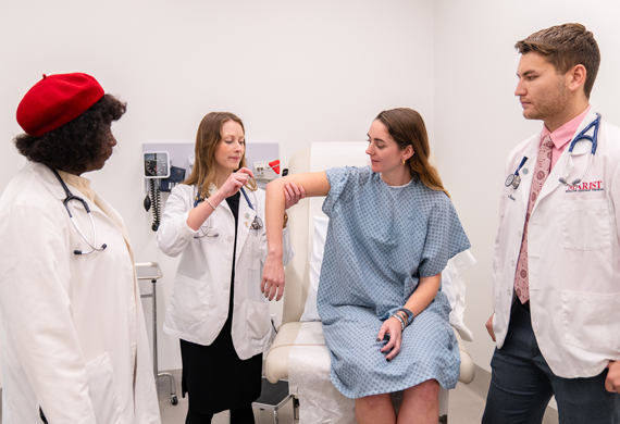 Image of students conducting an examination.