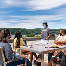 An image of students talking outside. 