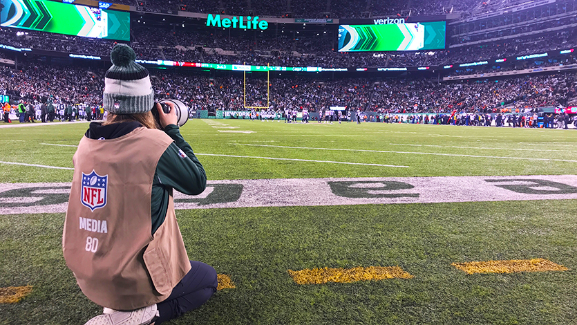 Photo of Gabriella Ricciardi '20 photographing Jets game