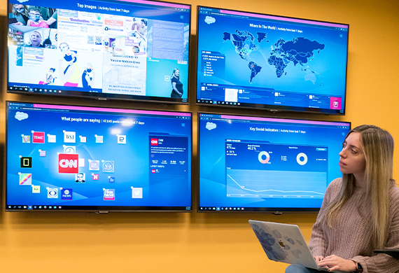 Marist University's image of a student working in the Center for Social Media.