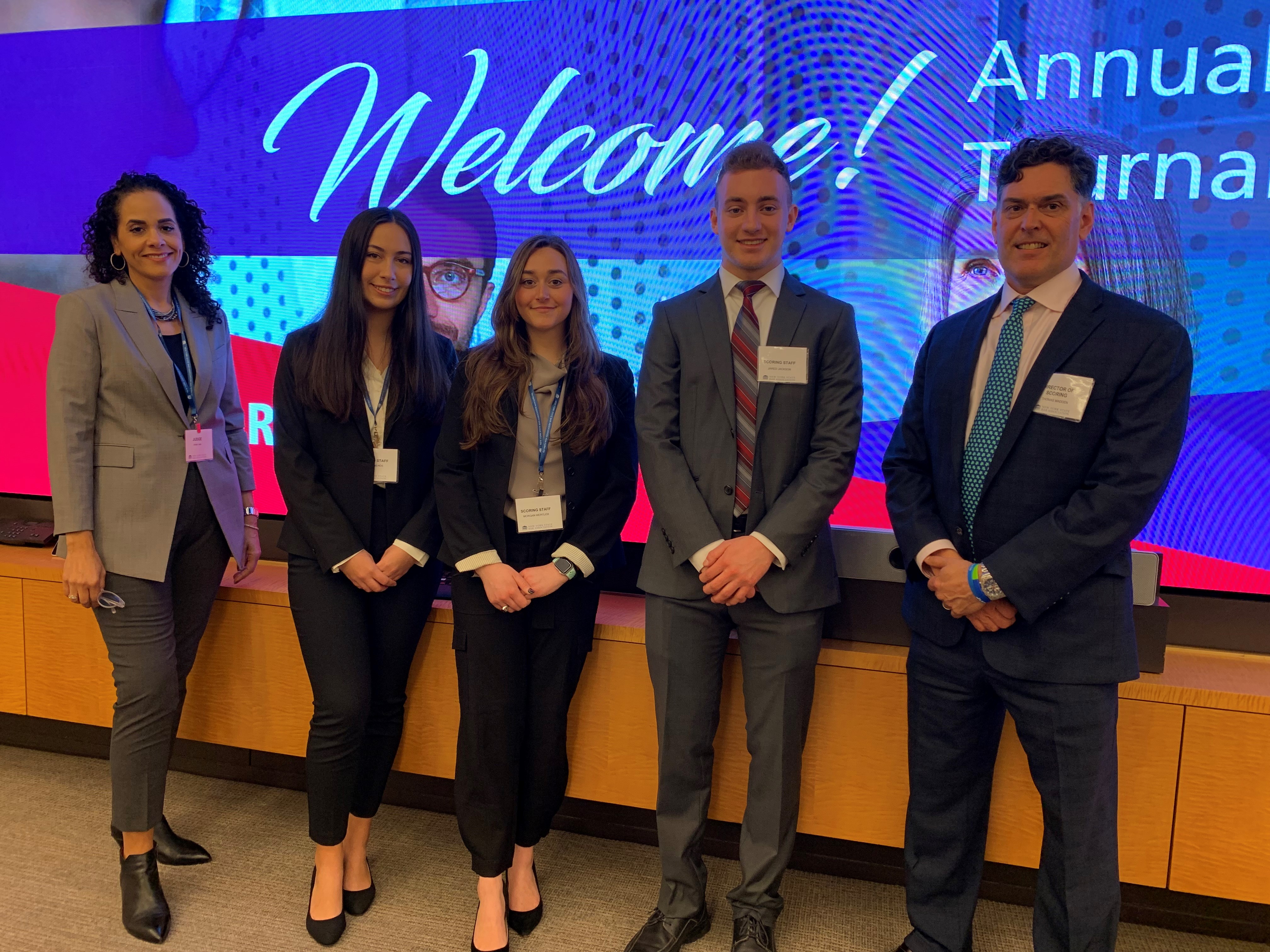 IN THE PHOTO (from left): Prof. Jennifer Lupo, Sophia Mailhos ’22, Morgan Wertlieb ’22, Jared Jackson ’22, and Prof. Thomas Madden at the mediation tournament