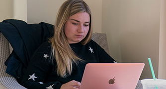 An image of a woman on her laptop. 