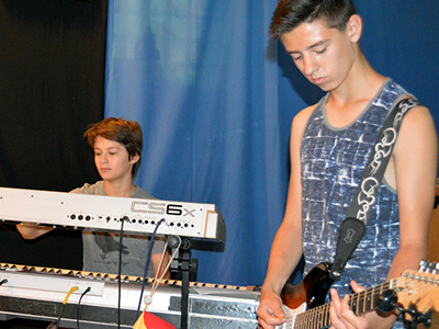 Photo of campers playing music