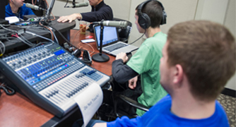 Image of student recording a podcast