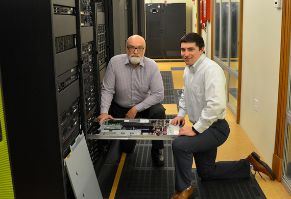 Image of student and faculty member collaborating in a lab.