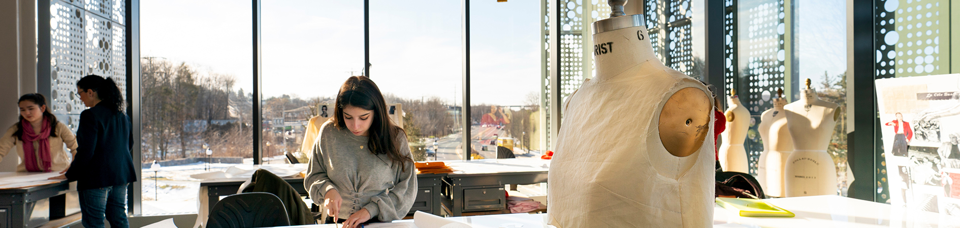 Photo of student working in senior fashion design studio
