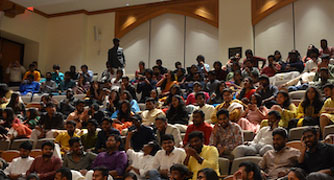 Image of students seated in a large event space.