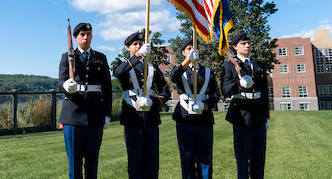 An image of military students presenting the colors at a campus event.