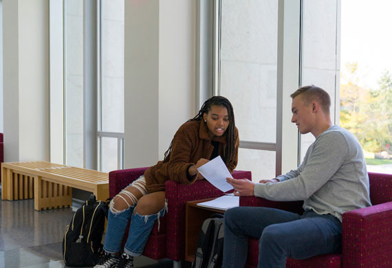 An image of students collaborating on campus