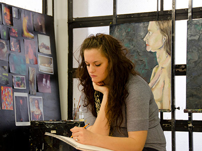 Photo of student drawing in a studio