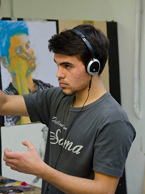Photo of student working with art