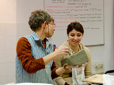 Photo of faculty member working with student