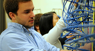 Photo of student working with wires