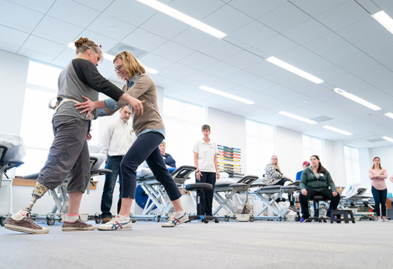 Image of Doctor of Physical Therapy student interacting with a patient.