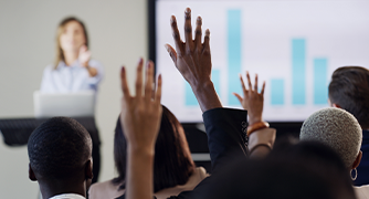 Image of hands being raised.