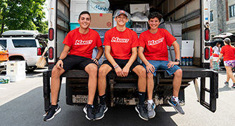 Photo of three Marist students helping with Move-in day