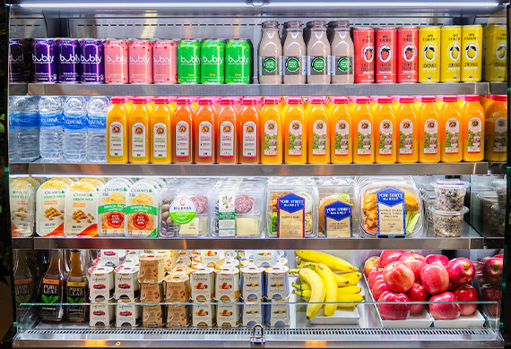 Image of drinks and snacks in convenience cooler.