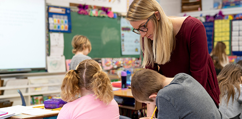 Photo of student teacher with students