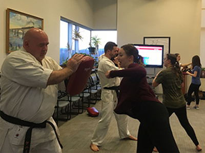 Photo of social work students practicing self-defense
