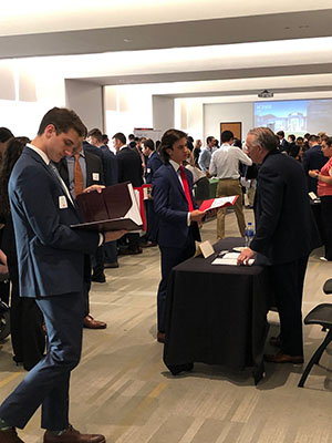 Students networking at Meet the Firms event