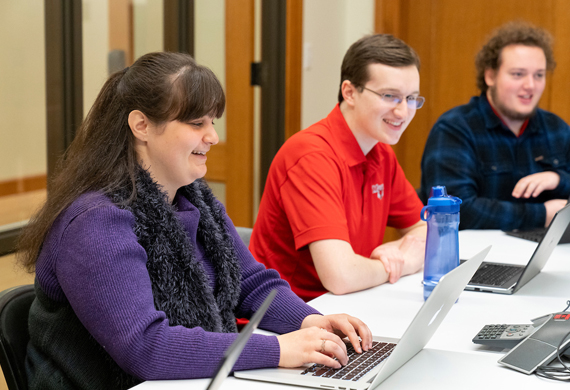 Image of female student working at a computer. 