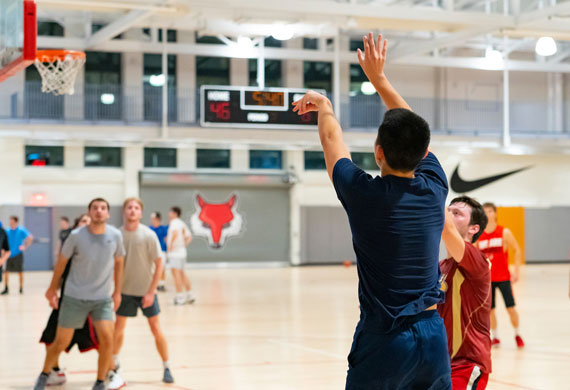 An image of students competing in intramural basketball.