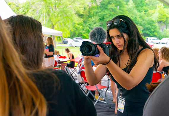 Image of Marist student taking a photo with professional camera