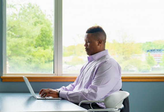 Image of a student working independently in a classroom.