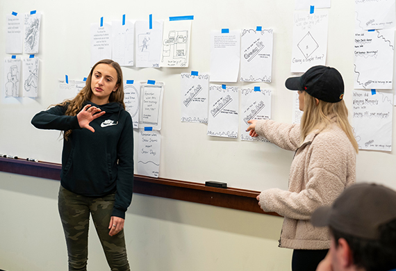 Image of students pitching an app in class