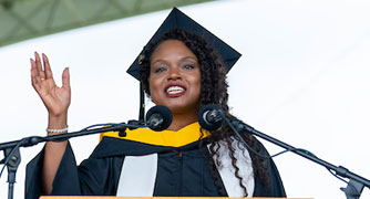 Image of a graduate speaking at the commencement ceremony.