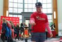 Image of student ringing bell.