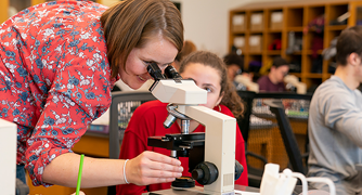 Image of Marist School of Science students at a microscope.
