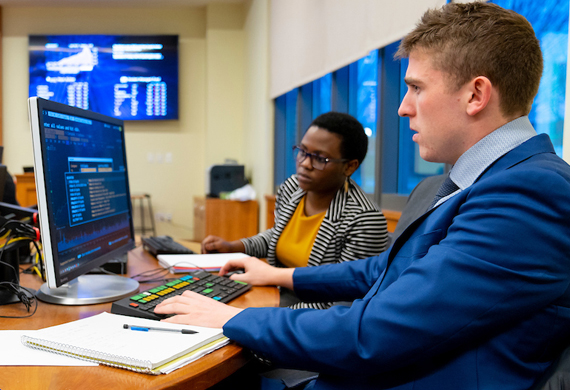 Image of a student working in a computer lab on campus.