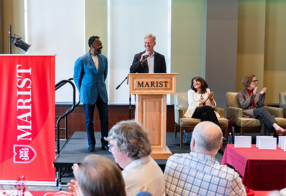 President Kevin Weinman recognizes Henry Graham for his career in Campus Safety and Security. Photo by Nelson Echeverria/Marist University.