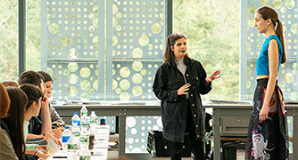 Image of a person explaining at career Academics