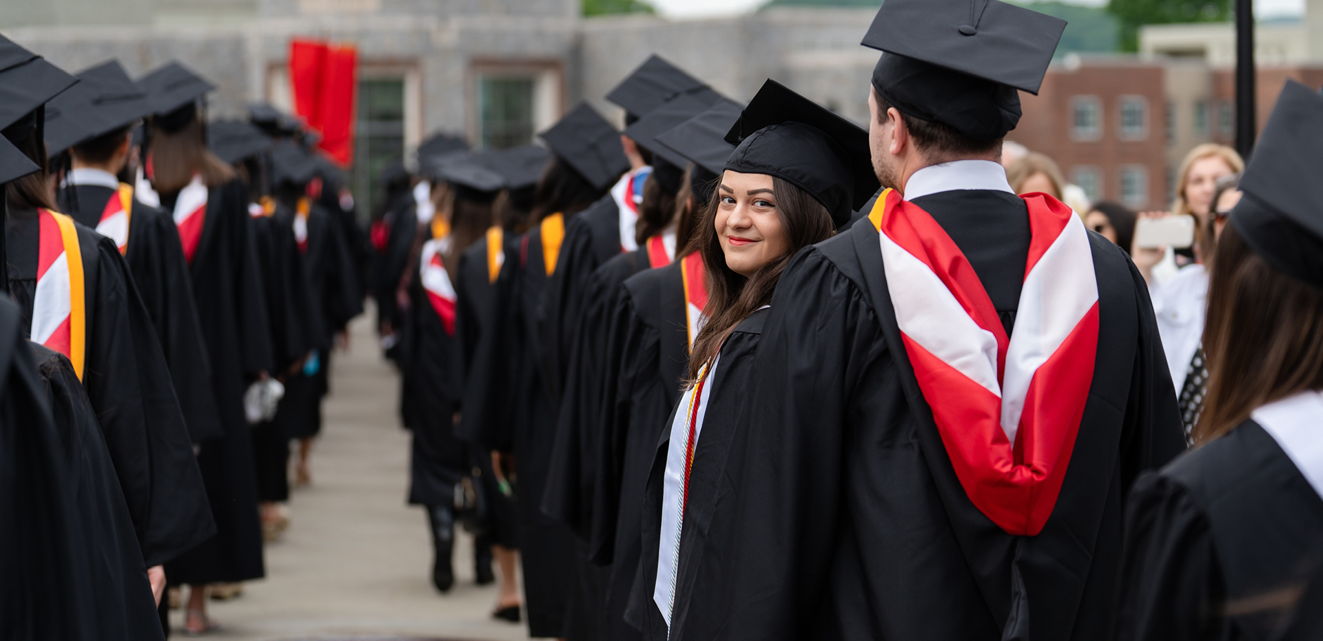Students lined up in regalia for commencement