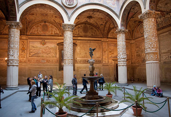 image of people inside a historic building in Italy