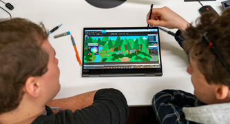 An image of students designing a game