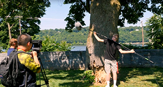 An image of students filming outside. 