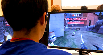 An image of a student playing a video game.