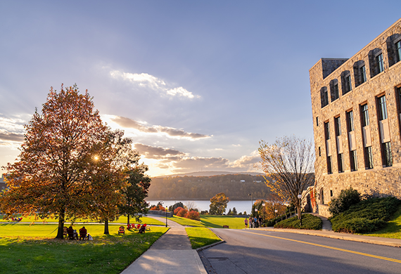 image of marist campus featuring foliage, the hudson river, and handcock building