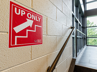 Image of "up only" stairs sign