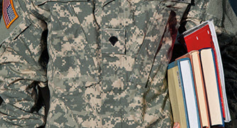 An image of a military student holding books. 