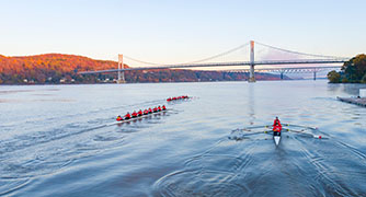 Image of Marist University crews rowing on the Hudson River.
