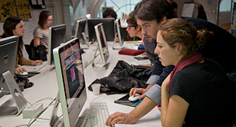 Two studenrts are discussing on watching computer