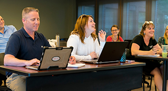 An image of adult students in a classroom.