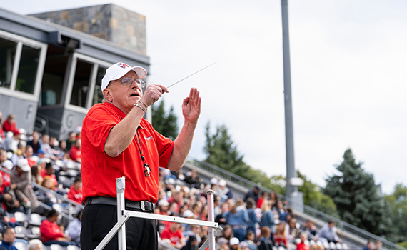 An image of Art Himmelberger conducting the band. 