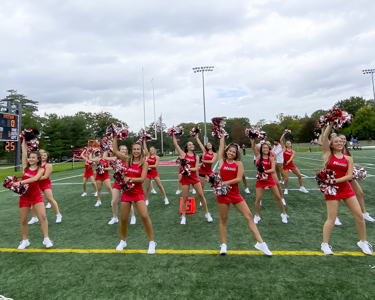 Image of the Marist Dance team performing during a football game at Tenney Stadium.